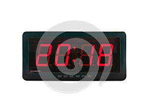 close up red led light illumination numbers 2018 on black digital electric alarm clock face isolated on white background