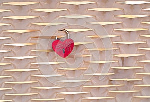 Close-up of red metal heart padlock
