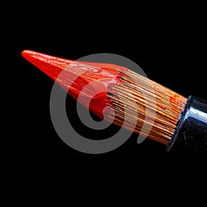 Close-Up of Red Pencil on Black Background