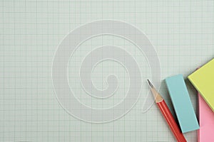 red pencil on graph paper background, education concept