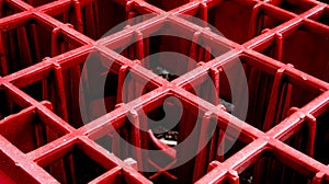 Close-Up of Red Plastic Grid Structure.
