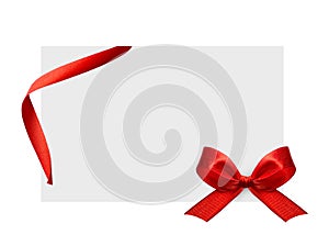 Close up of a red ribbon bow on white background