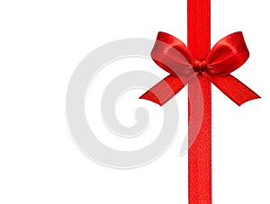 Close up of a red ribbon bow on white background