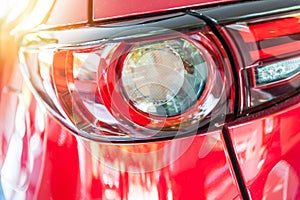 Close up of a red sport car in sunset