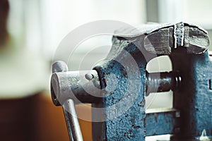 Old iron vise on the table