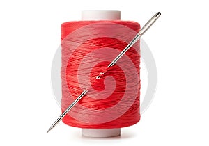 Red thread spool with needle, sewing and craft supplies on white background {Ai generated