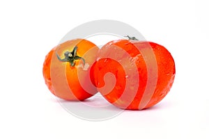 Close up red tomatoes isolated on white background.Tomato with droplets of water.Fresh tomatoes ready to cook.Tomatoes are vegetab