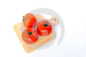 Close up red tomatoes isolated on white background.Tomato with droplets of water.Fresh tomatoes ready to cook.Tomatoes are vegetab