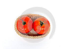 Close up red tomatoes isolated on white background.Tomato with droplets of water.Fresh tomatoes ready to cook.Tomatoes are vegetab