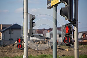 Close-up red traffic light in city street, on pedestrian red traffic light number 21 on dial