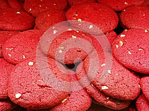 Close up of red velvet cookies with almonds arranged randomly