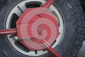 Close up of a red Wheel clamp