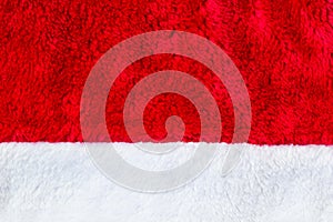 Close up red and white Santa Claus hat texture to backround