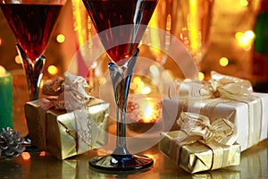 Close-up of red wine and gifts.