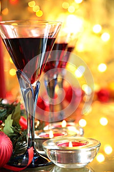 Close-up of red wine in glasses and candle lights.