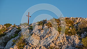 Close up of red wooden cross on the Debelo Brdo peak