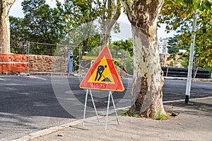 Road works sign on sunny street