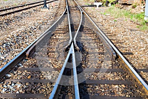 Close up of redirection old train or railroad tracks with wooden backing In the countryside photo