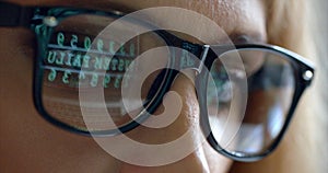 The close-up reflection of the code in the businesswoman spectacles. Crime Hacker Internet Browsing Hacking 4k.