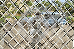 Close-up Reflection From Grilled Tinted Glass