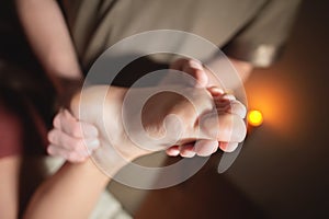 Close-up reflexology foot massage. Male masseur makes foot massage to a female client. Foot Care Concept