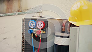 Close up of refrigerant manifold gauges