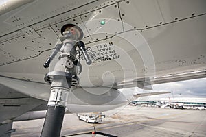 Close-up refueling of airplane at airport