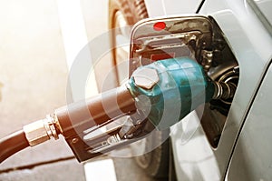 Close up Refueling Car fill with gasoline at a gas station and with fuel at he refuel station. Car refueling on petrol pump