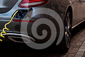 Close-up refueling an electric car.