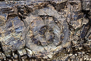 Close-up relief of big rocks. Natural igneous rock background texture