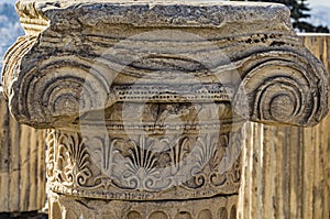 Close-up of the remains of the column with its Ionic capital with scrolls and flourishes on the Acropolis of Athens. Athens.