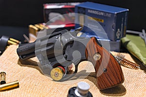 Close-up on the replica of a revolver Colt Lawman MK Ã¢â¦Â¢ 357 Magnum CGT with bullets.