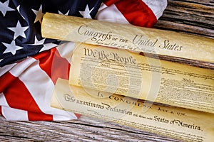 Close up of a replica of U.S. document of American constitution We the people with USA Flag