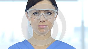 Close Up of Reseach Scientist, Doctor Wearing Protective Glasses