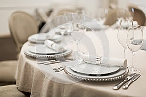 Close-up of a reserved table in a restaurant. Expensively decorated restaurant table