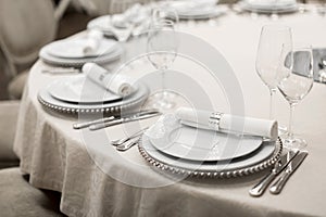 Close-up of a reserved table in a restaurant. Expensively decorated restaurant table