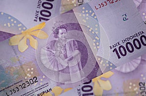 Close up on the reverse side of a 10000 Rupiah banknote. A fan of Indonesian banknotes