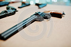 Close up revolvers guns on shooting range.