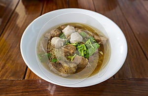 Close up Rice noodle soup with Stewed pork in white bowl