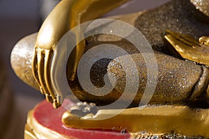 close up of the right hand of buddha statue in temple thailand