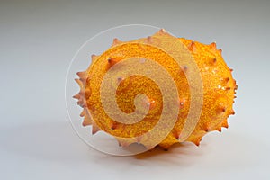 Close-up of a ripe Kiwano or Horned Melon fruit, on white background