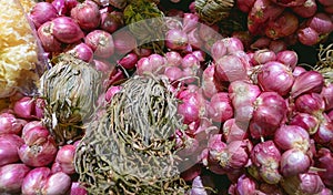 Close-up ripe red onions as background on shelf in supermarket,defocus