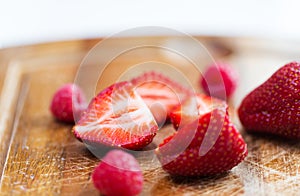 Close up of ripe red strawberries on cutting board