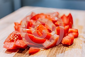 Close-up of ripe tomato chopped on wooden background. Natural and healthy food background