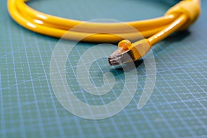 Close up of RJ-45 cable on blue background