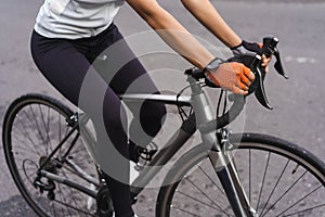 close up of a road bike frame, ride by female cyclist