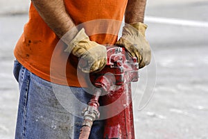 close up of a Road maintenance worker using a jackhammer