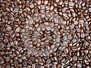 Close up of Roasted coffee beans isolated background, ready to give freshness and alongside the businessman