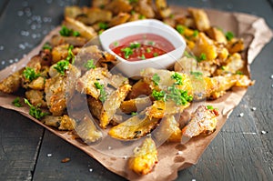 Close-up of roasted potatoes with rosemary, Parmesan cheese and fresh parsley on top