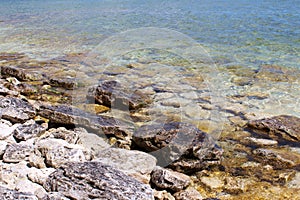 Close up of textured rocks on the shoreline and lakebed of Lake Michigan in Sturgeon Bay, Wisconsin